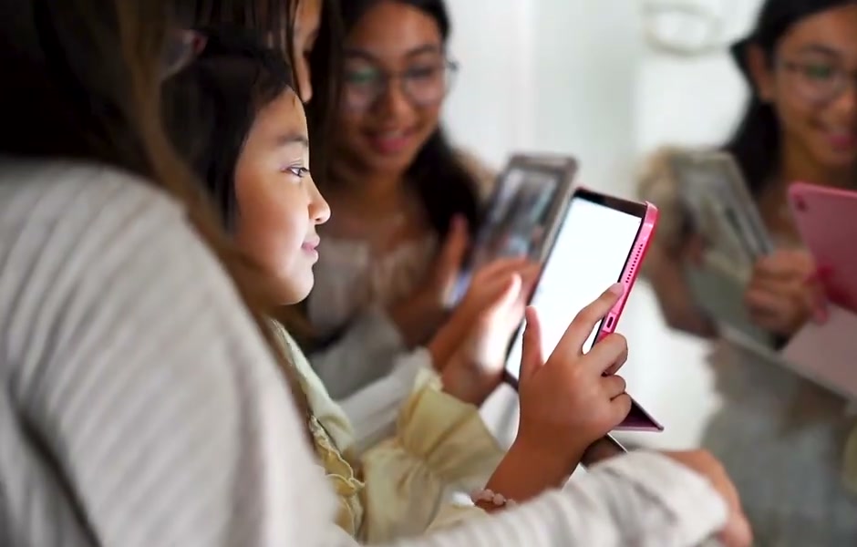 Young students exploring iPads together
