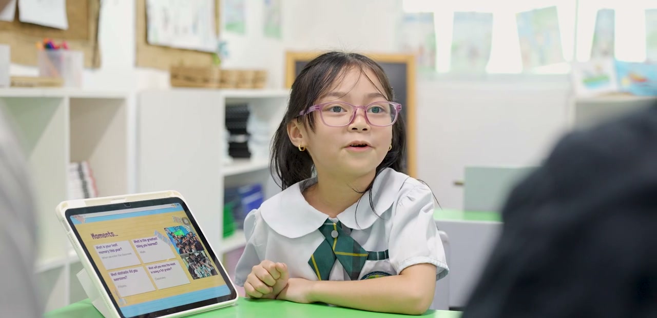 A Brightwoods student sharing her work on iPad